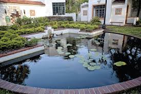 Art & History Museum Maitland white stucco buildings with pond in forefront