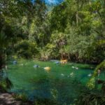 looking down on lagoon with paddlers and kayakers