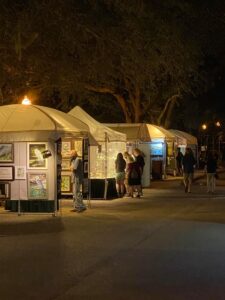 Festival tents at night.