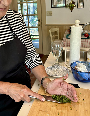 chopping herbs in cooking class